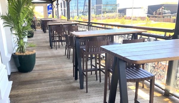 Delta bar height tables and wooden table tops.