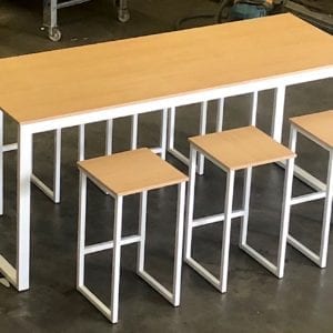 Large bar table in white and matching chairs.