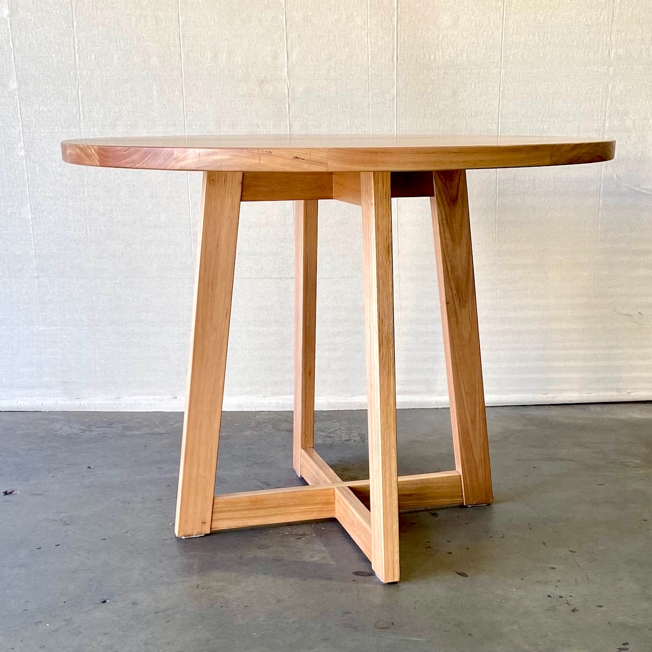 Cross side/dining table 800mm round in NSW Blackbutt timber.